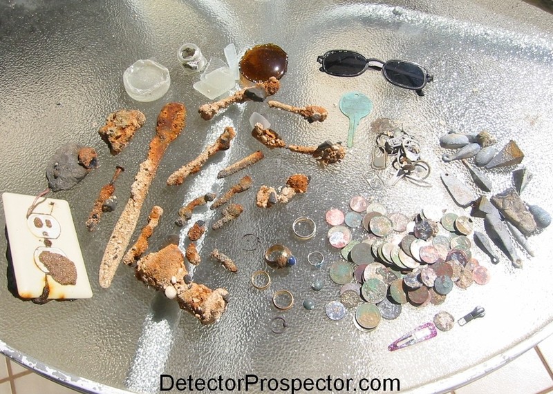 Iron junk, rings, coins, aluminum trash, and lead weights found metal detecting