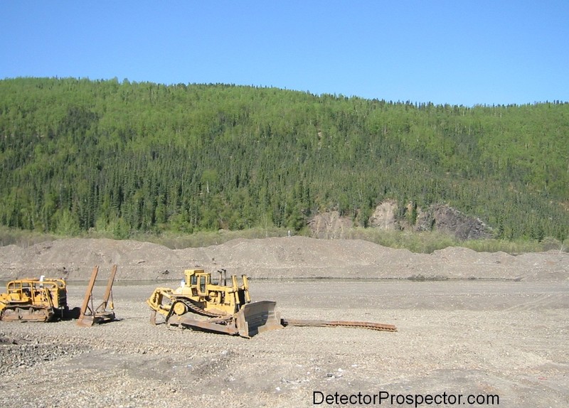 Tailing piles along airstrip at Ganes Creek